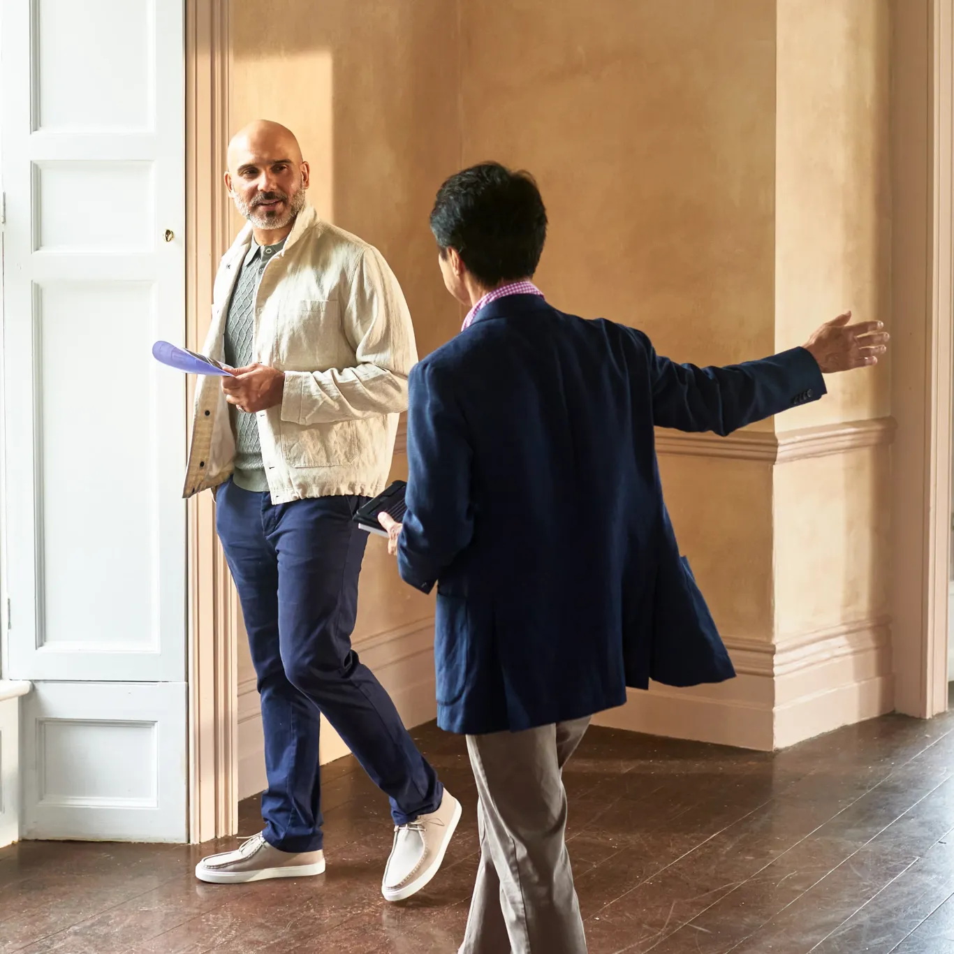 Agent showing client a property